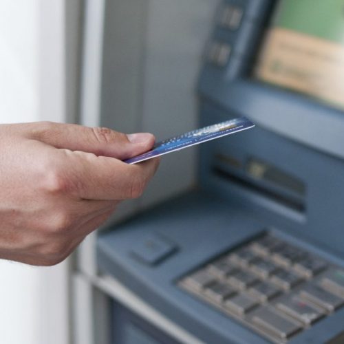 hand-inserting-atm-card-into-bank-machine-withdraw-money-businessman-men-hand-puts-credit-card-into-atm-1-min-1024x680-1
